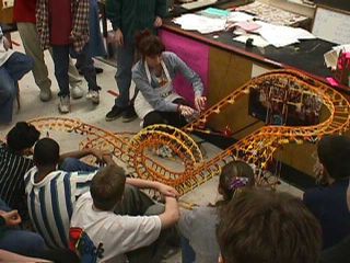 Misti Taton explaining the physics of roller coasters